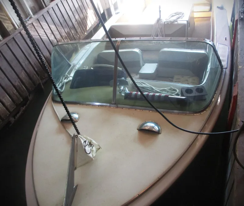 Slide: The Image of 1963 Coronado 21 by Century boat docked in a wooden boathouse. - 10