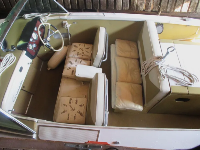 Slide: The Image of 1963 Coronado 21 by Century boat interior with vintage seats and steering wheel. - 14