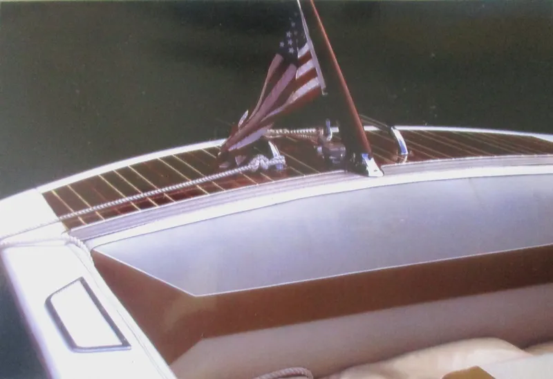 Slide: The Image of 1963 Coronado 21 by Century boat with American flag on deck. - 4