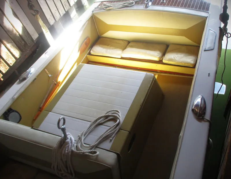 Slide: The Image of 1963 Coronado 21 by Century boat interior with seating and ropes. - 9