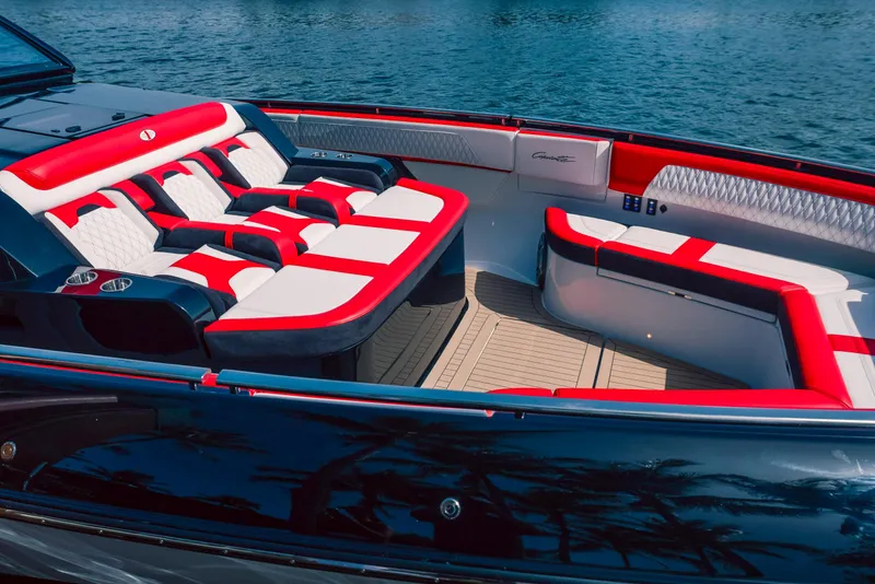 Slide: The Image of 2025 Cigarette 52 Thunder boat with red and white seating, docked on water. - 10