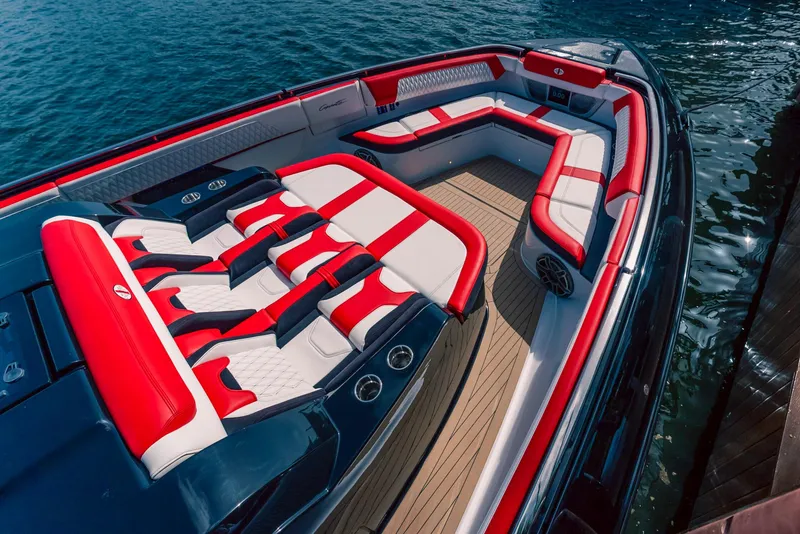 Slide: The Image of 2025 Cigarette 52 Thunder boat with luxurious red and white seating on the water. - 11
