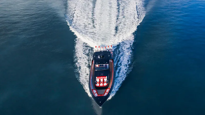 Slide: The Image of Aerial view of 2025 Cigarette 52 Thunder speedboat cruising on open water. - 12