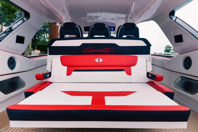 Slide: The Image of 2025 Cigarette 52 Thunder luxury boat interior with red and white seating. - 18