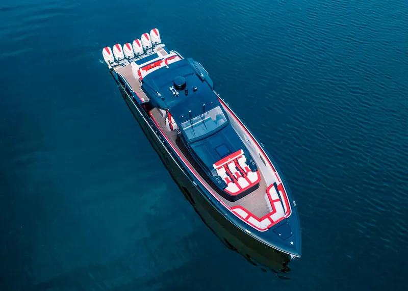 Slide: The Image of 2025 Cigarette 52 Thunder luxury speedboat on calm water. - 2