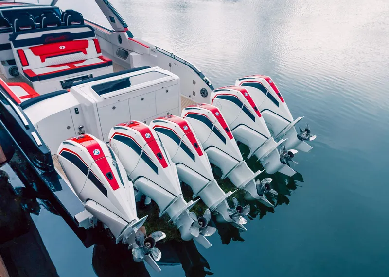 Slide: The Image of 2025 Cigarette 52 Thunder boat with six powerful outboard engines on water. - 20