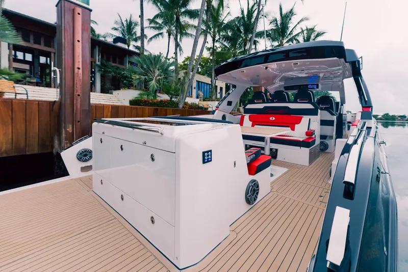 Slide: The Image of 2025 Cigarette 52 Thunder luxury boat docked near palm trees. - 21