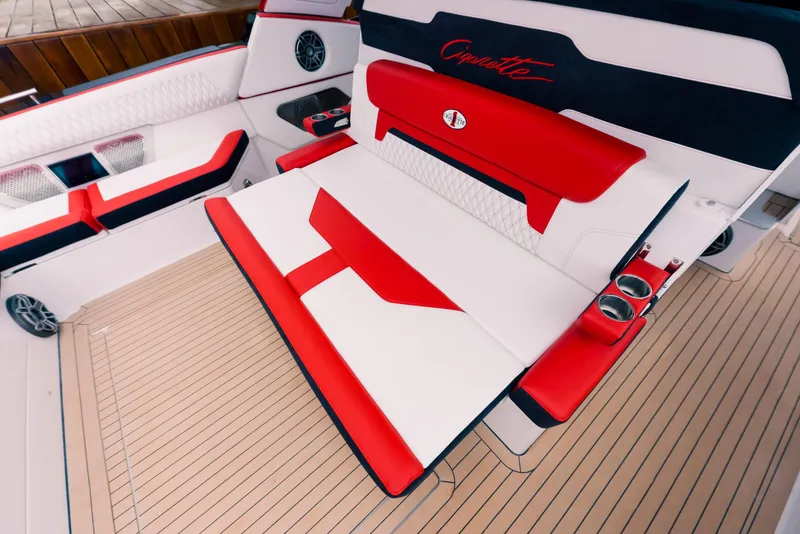 Slide: The Image of 2025 Cigarette 52 Thunder boat interior with red and white seating and cup holders. - 26