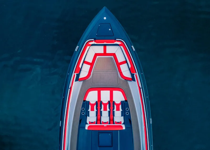Slide: The Image of Top view of 2025 Cigarette 52 Thunder boat with red and white seating. - 7