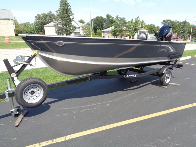 The Image of 2024 Lund 1600 Fury Tiller boat on trailer in parking lot. - 0
