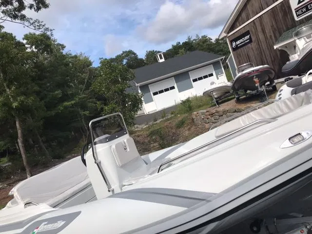 Slide: The Image of 2024 Zar Formenti 43 boat on LoadRite trailer at Zar New England dealership. - 2