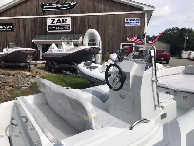 Slide: The Image of 2024 Zar Formenti 43 boat on a trailer in a sunny outdoor setting. - 3