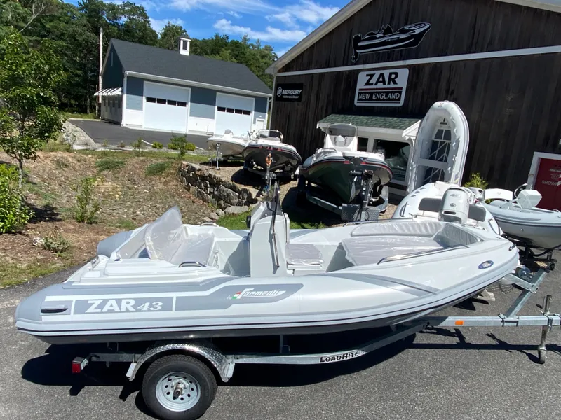 Slide: The Image of 2024 Zar Formenti 43 boat at dealership with other boats in background. - 6