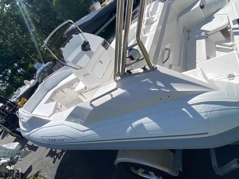 Slide: The Image of 2024 Zar Formenti 49 SL inflatable boat in white, docked outdoors. - 10