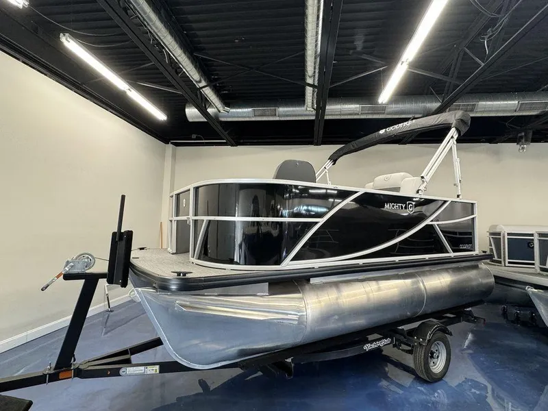 Slide: The Image of 2024 Godfrey MG 1476 F pontoon boat on trailer in showroom. - 5