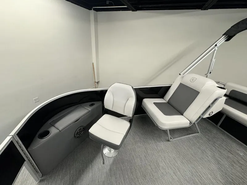 Slide: The Image of 2024 Godfrey MG 1476 F boat interior with white and gray seating. - 7