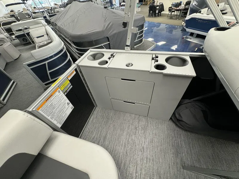 Slide: The Image of Interior of 2024 Godfrey MG 1476 F pontoon boat with storage and cup holders. - 9