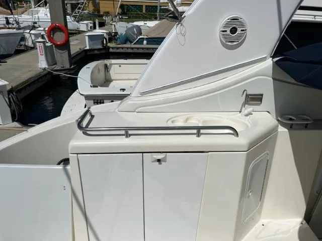 Slide: The Image of 2003 Cruisers Yachts 3772 Express boat deck with sink and storage. - 21