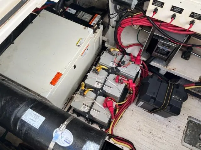 Slide: The Image of Engine compartment of a 2003 Cruisers Yachts 3772 Express with batteries and wiring. - 22