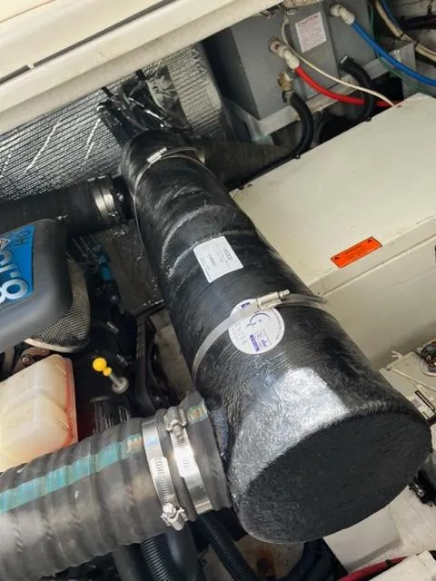 Slide: The Image of Engine compartment of a 2003 Cruisers Yachts 3772 Express with visible components. - 26