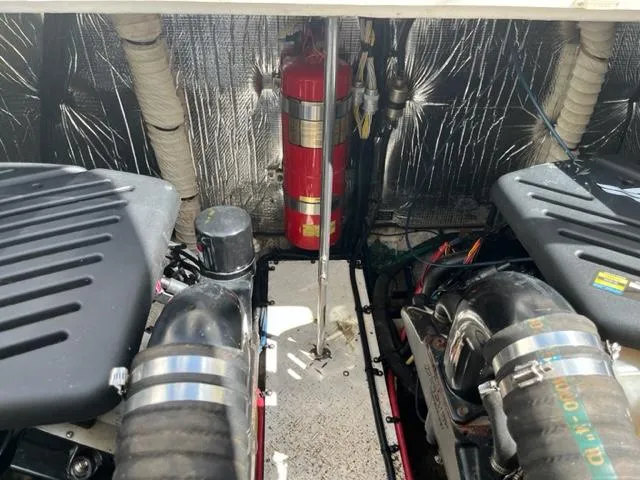 Slide: The Image of Engine compartment of a 2003 Cruisers Yachts 3772 Express with fire extinguisher. - 28