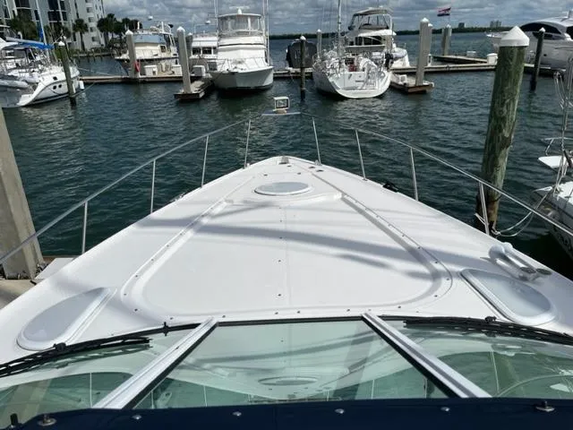 Slide: The Image of 2003 Cruisers Yachts 3772 Express docked at a marina, view from the bow. - 31