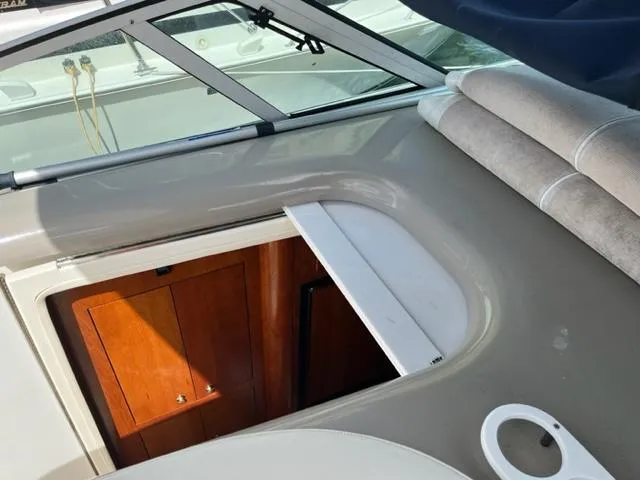 Slide: The Image of 2003 Cruisers Yachts 3772 Express interior cabin entrance with wooden door. - 33