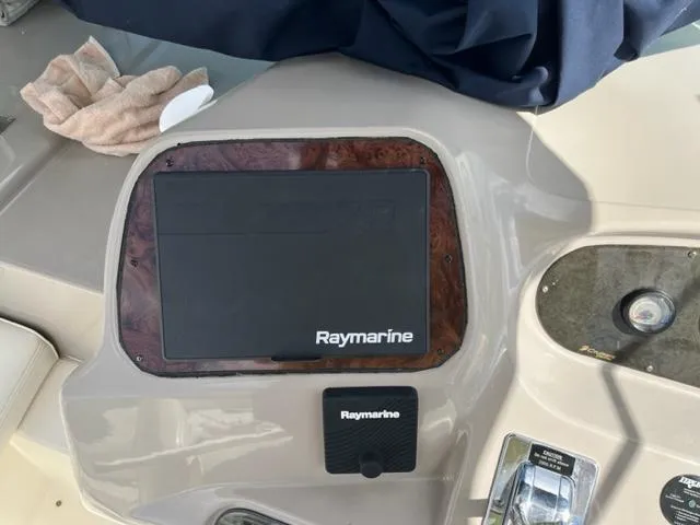 Slide: The Image of Raymarine navigation system on 2003 Cruisers Yachts 3772 Express dashboard. - 34