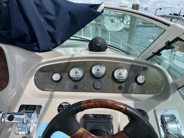 Slide: The Image of 2003 Cruisers Yachts 3772 Express helm with gauges and steering wheel. - 35