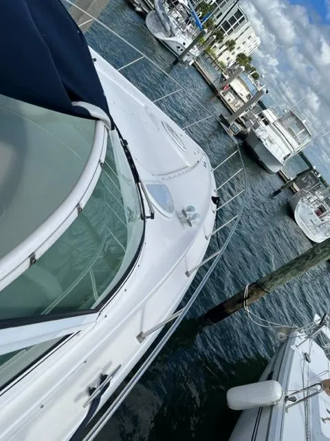 Slide: The Image of 2003 Cruisers Yachts 3772 Express docked at a marina. - 36