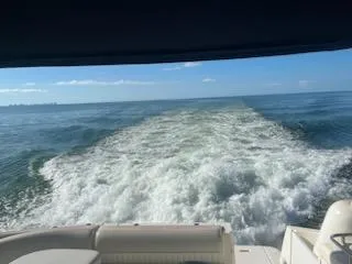 Slide: The Image of View from a 2003 Cruisers Yachts 3772 Express cruising on open water. - 41