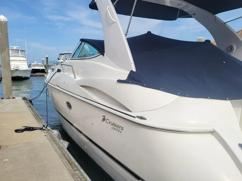 Slide: The Image of 2003 Cruisers Yachts 3772 Express docked at marina, side view. - 5