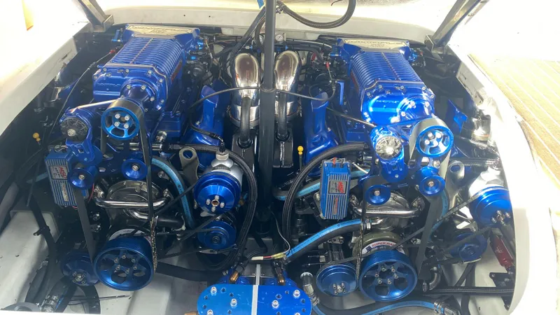 Slide: The Image of Twin engines of a 2000 Formula 400 SS boat with blue components. - 11
