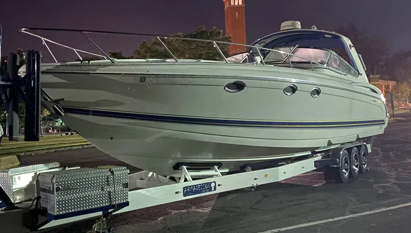 Slide: The Image of 2000 Formula 400 SS boat on a trailer at night. - 3