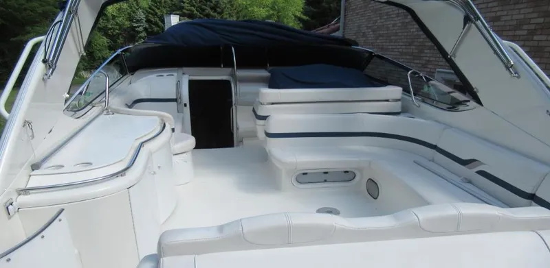 Slide: The Image of 2000 Formula 400 SS boat interior with white seating and covered cockpit. - 4