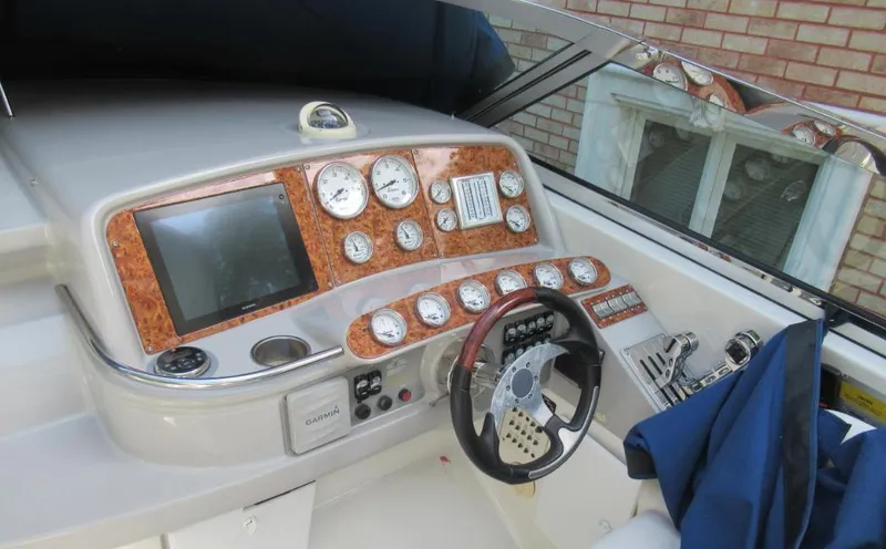Slide: The Image of 2000 Formula 400 SS boat dashboard with gauges and steering wheel. - 6