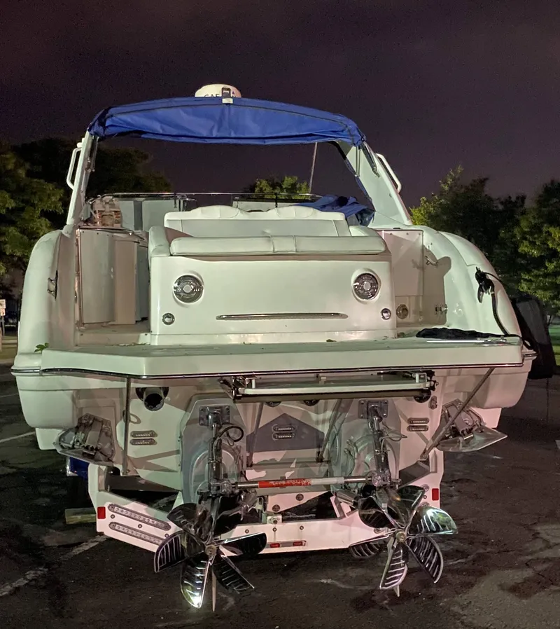 Slide: The Image of 2000 Formula 400 SS boat with dual propellers, rear view at night. - 8