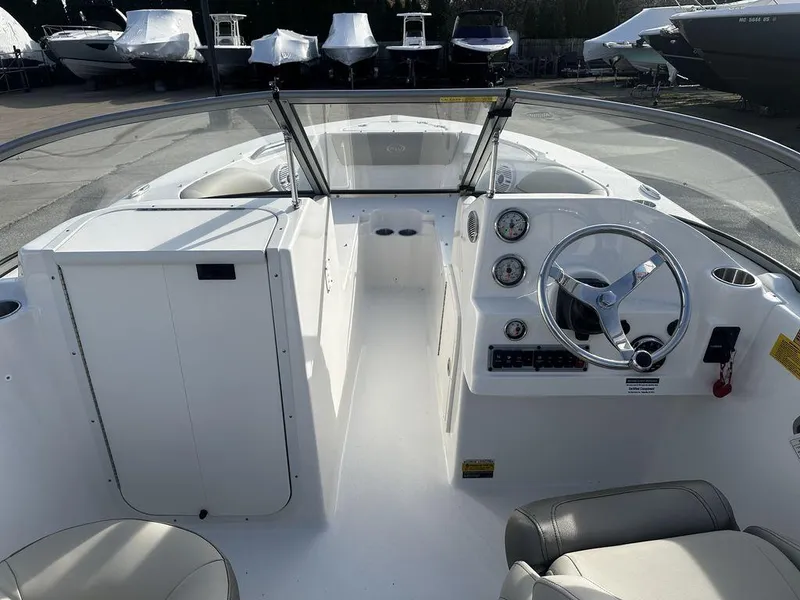 Slide: The Image of 2024 Key West 203 DFS boat interior with steering wheel and dashboard. - 5