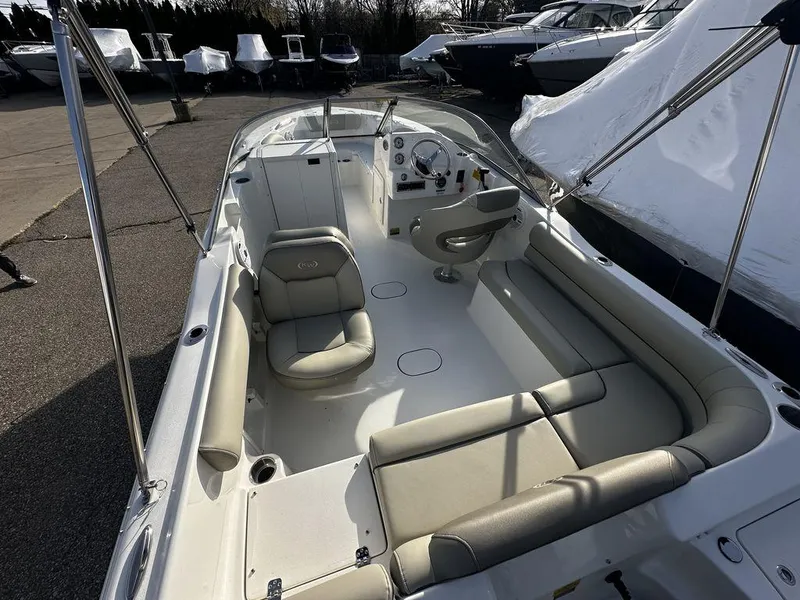 Slide: The Image of 2024 Key West 203 DFS boat interior with seating and steering console. - 7