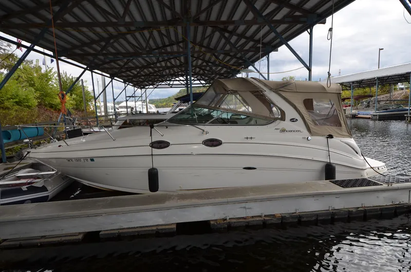 The Image of 2003 Sea Ray 280 DA boat docked under a covered marina. - 0