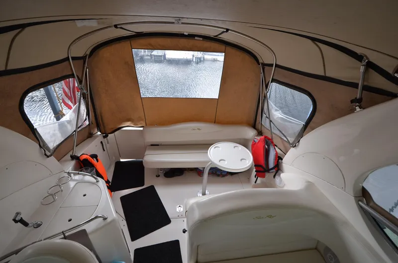 Slide: The Image of Interior of 2003 Sea Ray 280 DA boat with seating and table. - 10