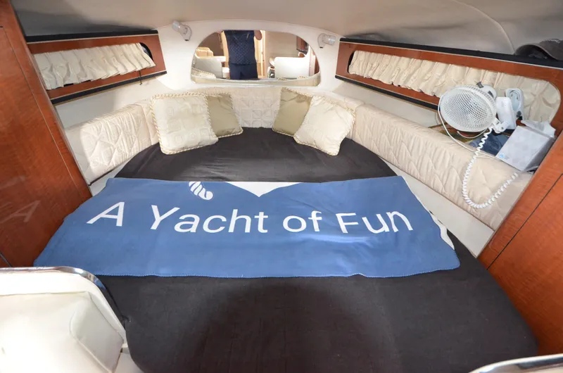 Slide: The Image of Interior cabin of a 2003 Sea Ray 280 DA yacht with cozy bedding. - 13