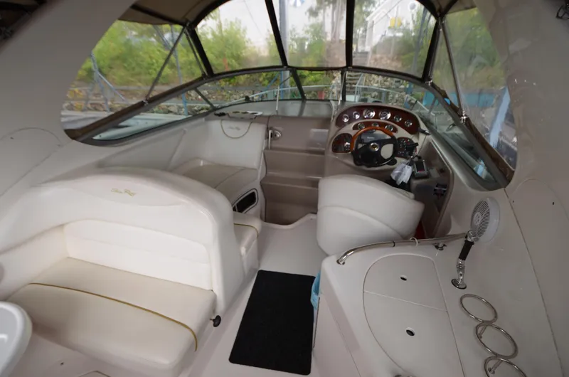 Slide: The Image of 2003 Sea Ray 280 DA boat interior with helm, seating, and dashboard. - 5