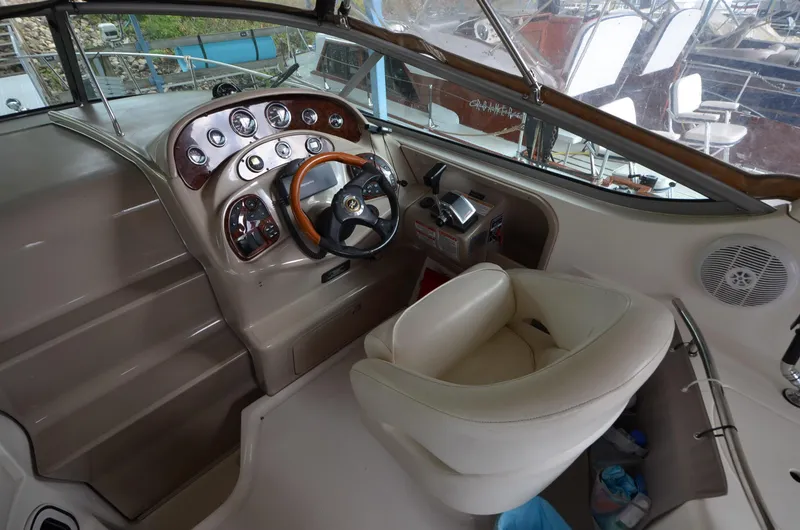 Slide: The Image of 2003 Sea Ray 280 DA boat helm with steering wheel and control panel. - 6