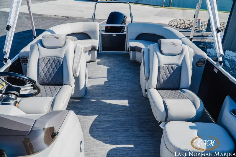 Slide: The Image of 2023 Bennington 23LSR pontoon boat interior with luxurious seating at Lake Norman Marina. - 15