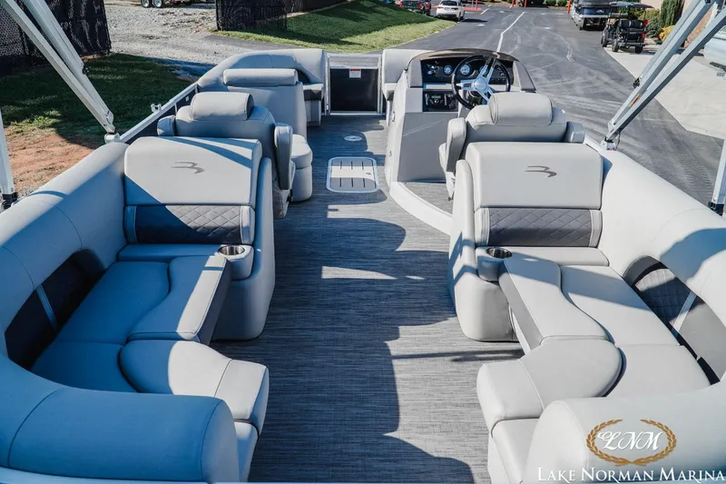 Slide: The Image of 2023 Bennington 23LSR pontoon boat interior with luxurious seating at Lake Norman Marina. - 6
