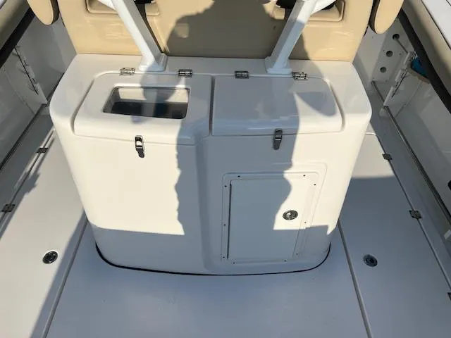 Slide: The Image of 2020 Tidewater 320 CC Adventure boat interior with storage compartments. - 11