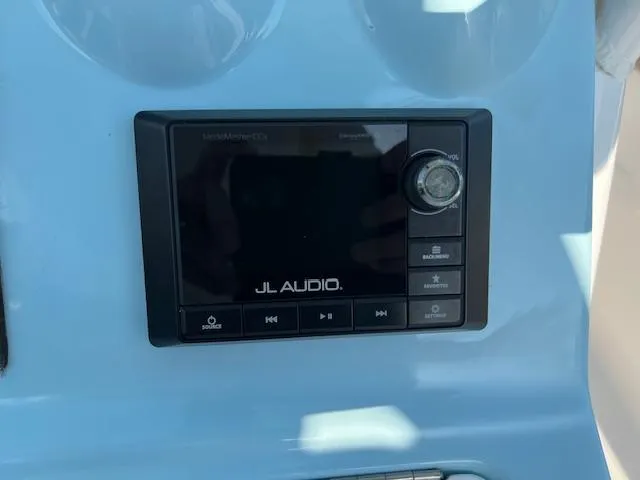 Slide: The Image of JL Audio system on 2020 Tidewater 320 CC Adventure boat dashboard. - 14