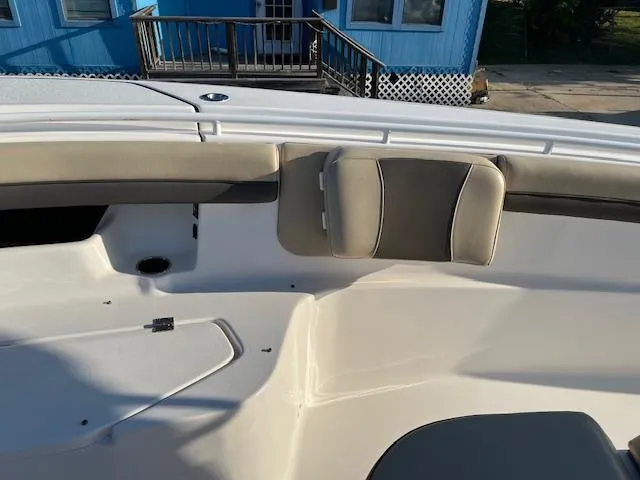 Slide: The Image of 2020 Tidewater 320 CC Adventure boat interior with cushioned seating. - 19