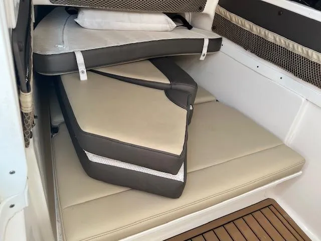 Slide: The Image of Interior cabin of 2020 Tidewater 320 CC Adventure with stacked cushions. - 25